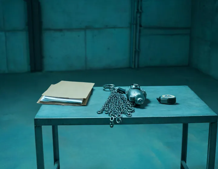 Buyer brief and hoist outline on a warehouse desk